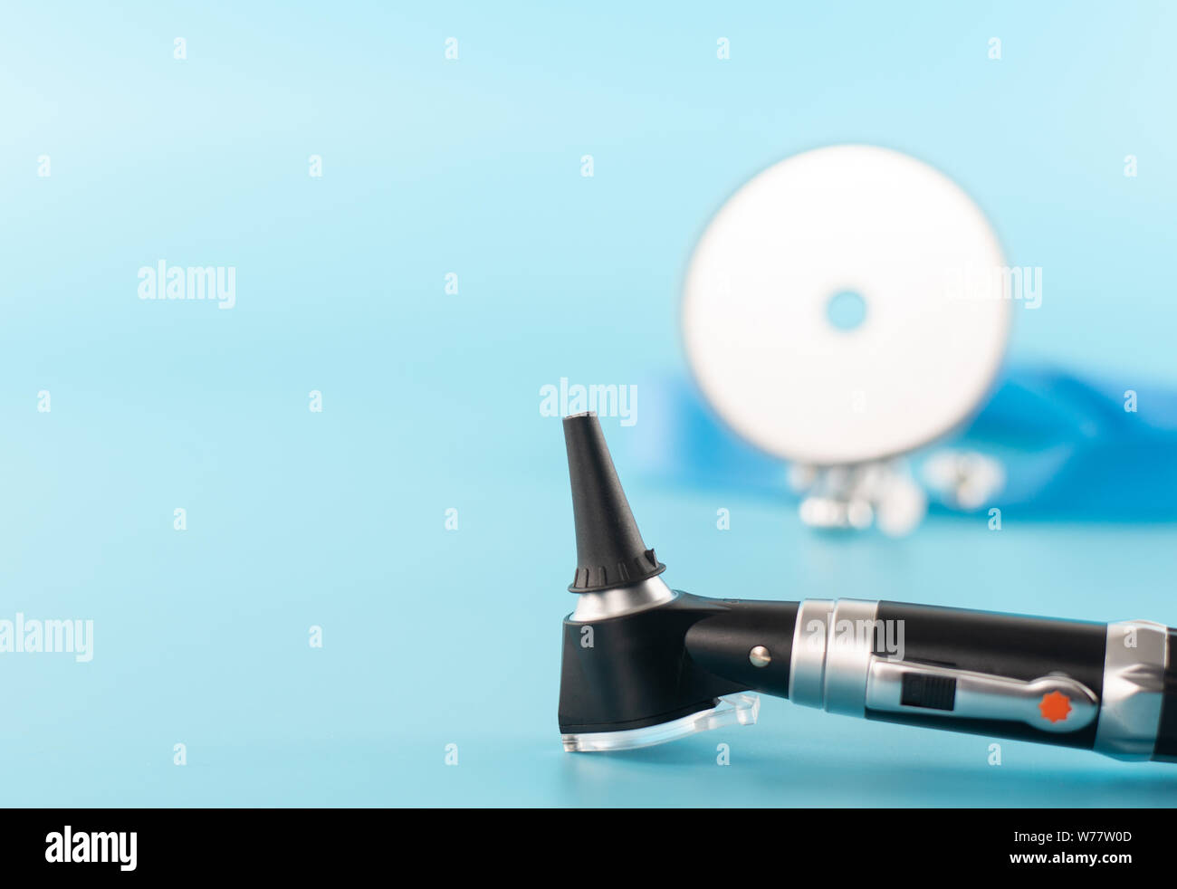 Ear professional instrument on blue background Stock Photo Alamy