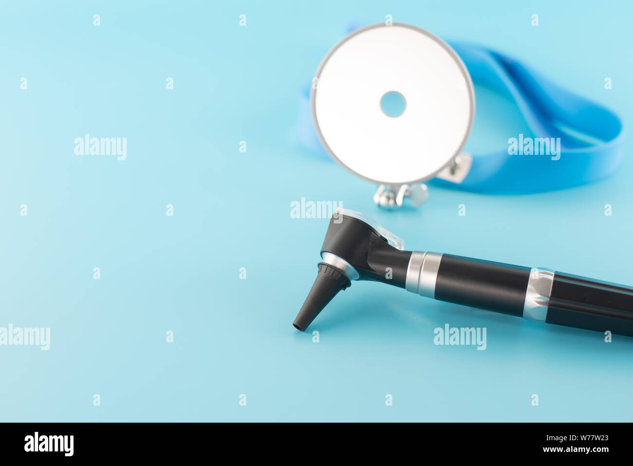 Ear professional instrument on blue background Stock Photo Alamy