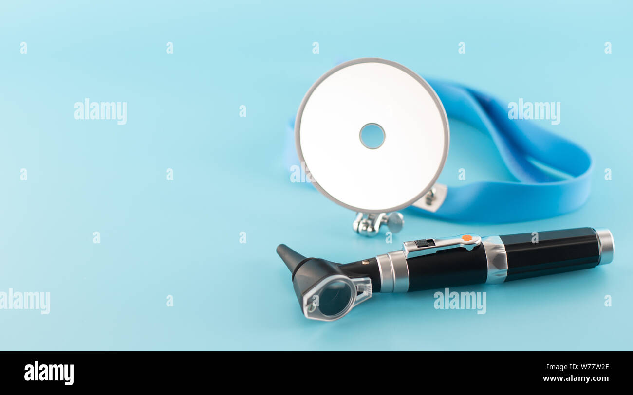 Ear professional instrument on blue background Stock Photo Alamy