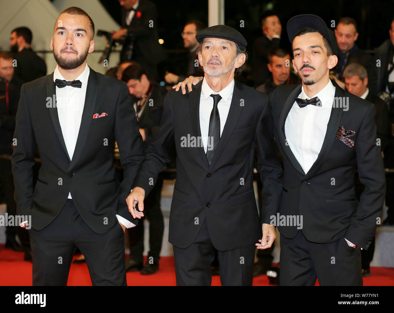 CANNES, FRANCE - MAY 19: Singers Bigflo and Oli with their father Fabian Ordonez attend the Diego Maradona screening during the 72nd Cannes Film Festi Stock Photo