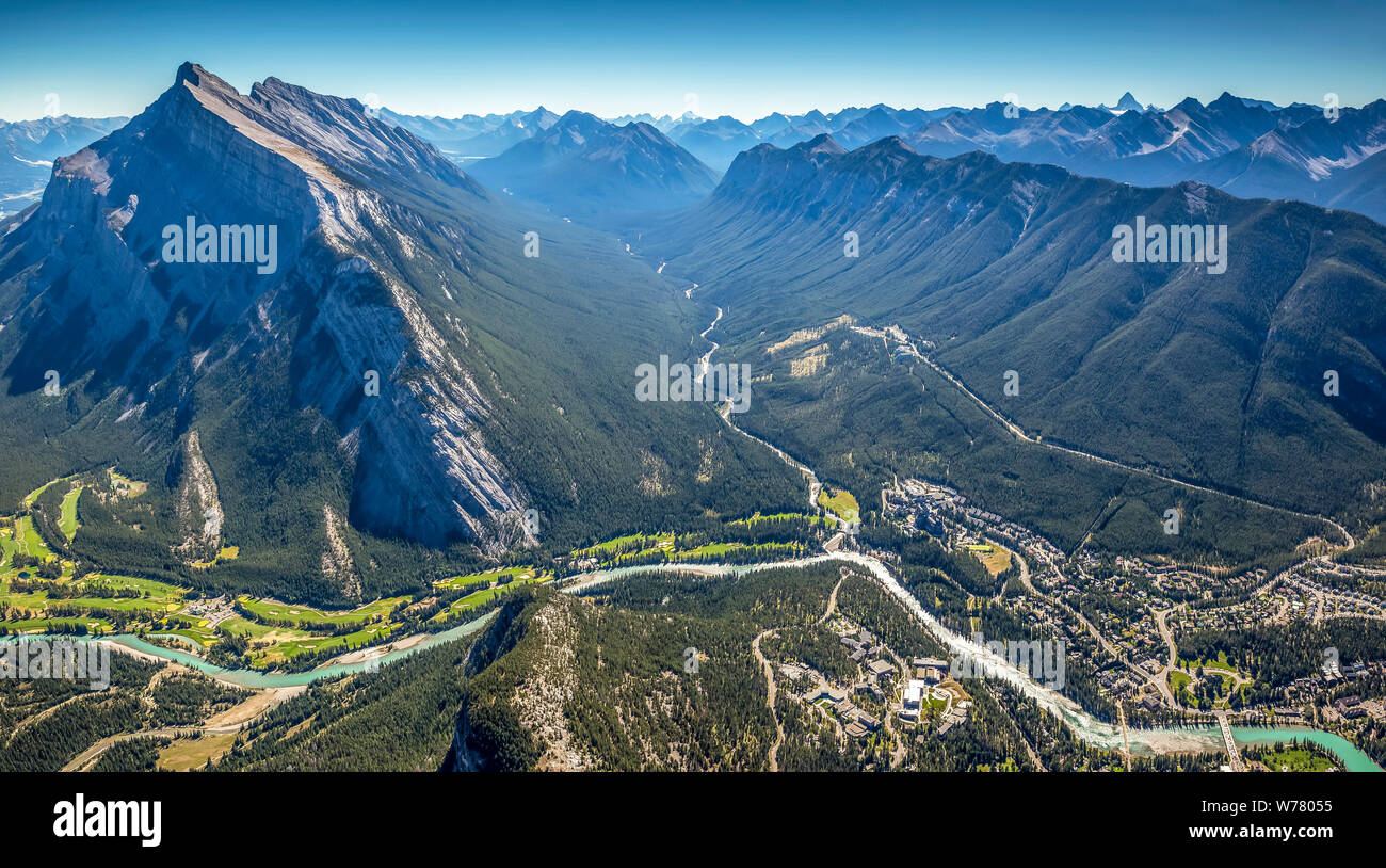 Aerial view of Banff, Alberta and nearby mountains including Mount Rundle and Sulphur Mountain. Stock Photo