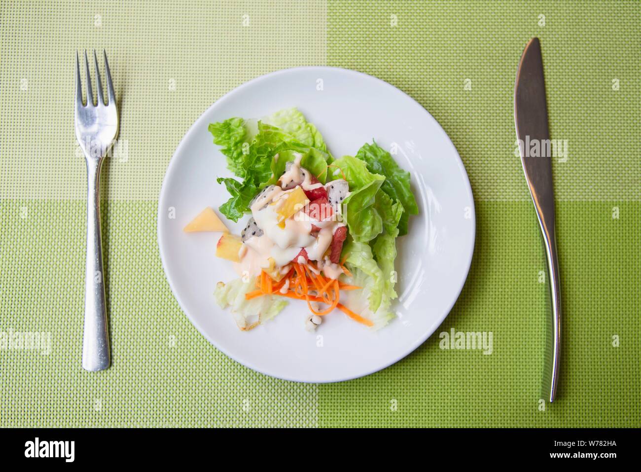 Fresh vegetable healthy salad on white plate ready for eating - fresh healthy food concept Stock Photo