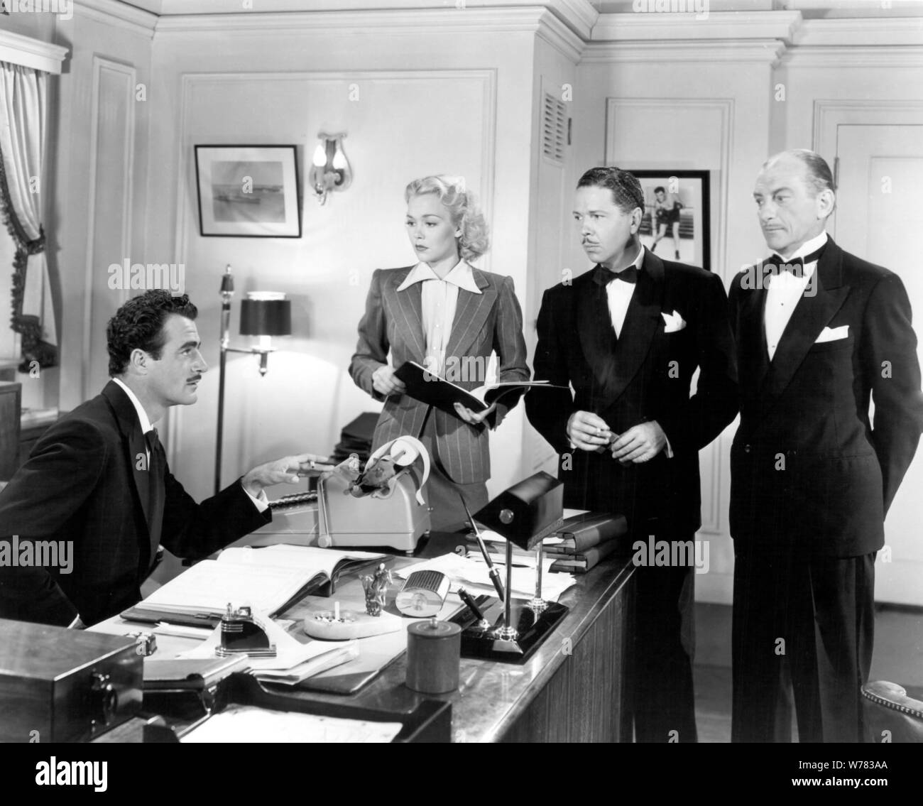 GILBERT ROLAND, JANE WYMAN, ROGER PRYOR & JOHN LITEL  Character(s): Greg Morella, Laurie Ogden, Max Gates, U.S. District Attorney  Film 'GAMBLING ON THE HIGH SEAS' (1940)  Directed By GEORGE AMY  22 June 1940  AFF24375  Allstar Picture Library/WARNER  **WARNING**This Photograph is for editorial use only and is the copyright of WARNER  and/or the Photographer assigned by the Film or Production Company & can only be reproduced by publications in conjunction with the promotion of the above Film. A Mandatory Credit To WARNER is required. The Photographer should also be credited when known. No comm Stock Photo