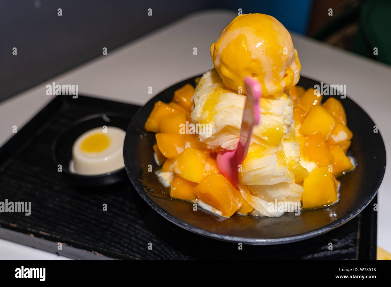 Mango fruit shaved ice and mango ice cream milk flavor serving with