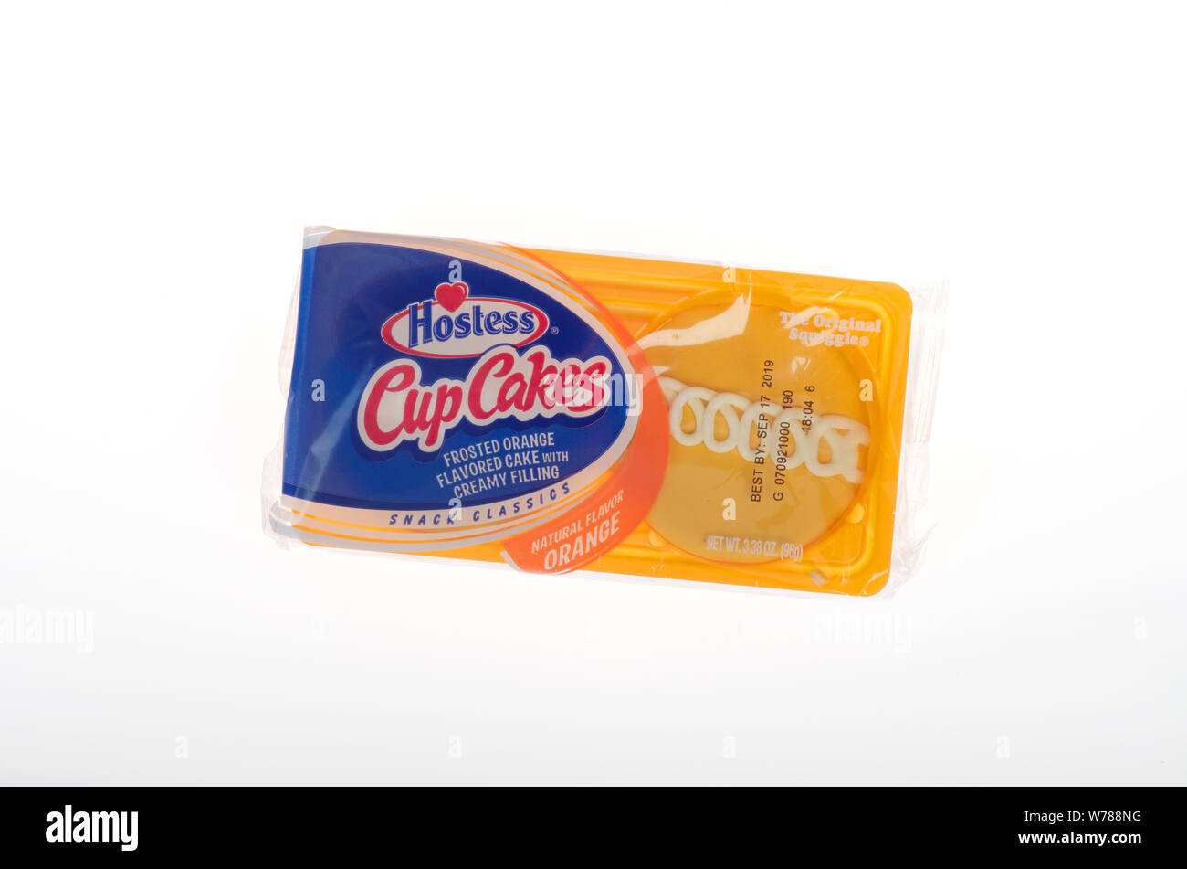 Hostess frosted orange cupcakes in package Stock Photo