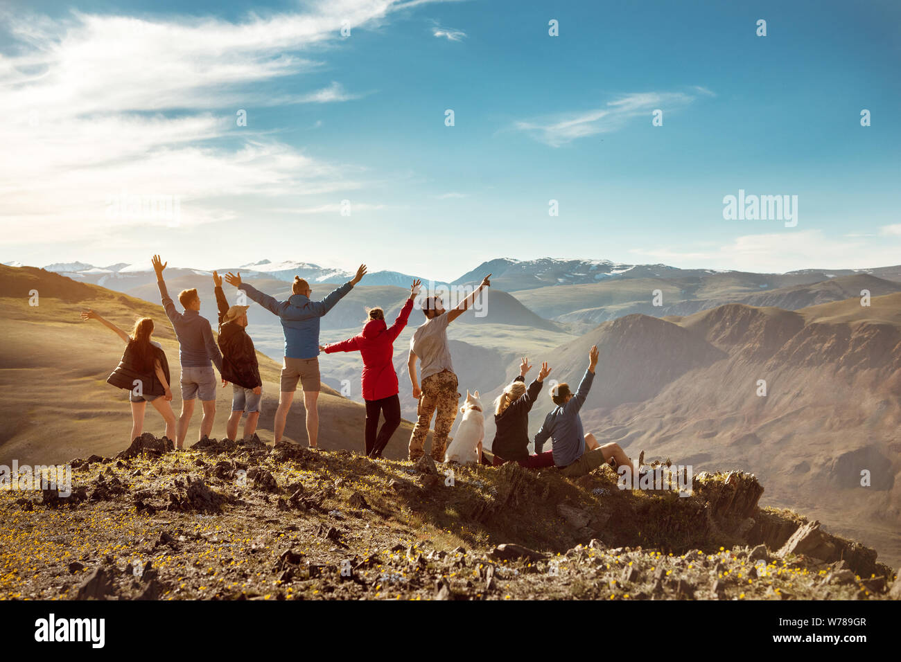 Big group of happy friends or tourists are having fun in mountains Stock Photo