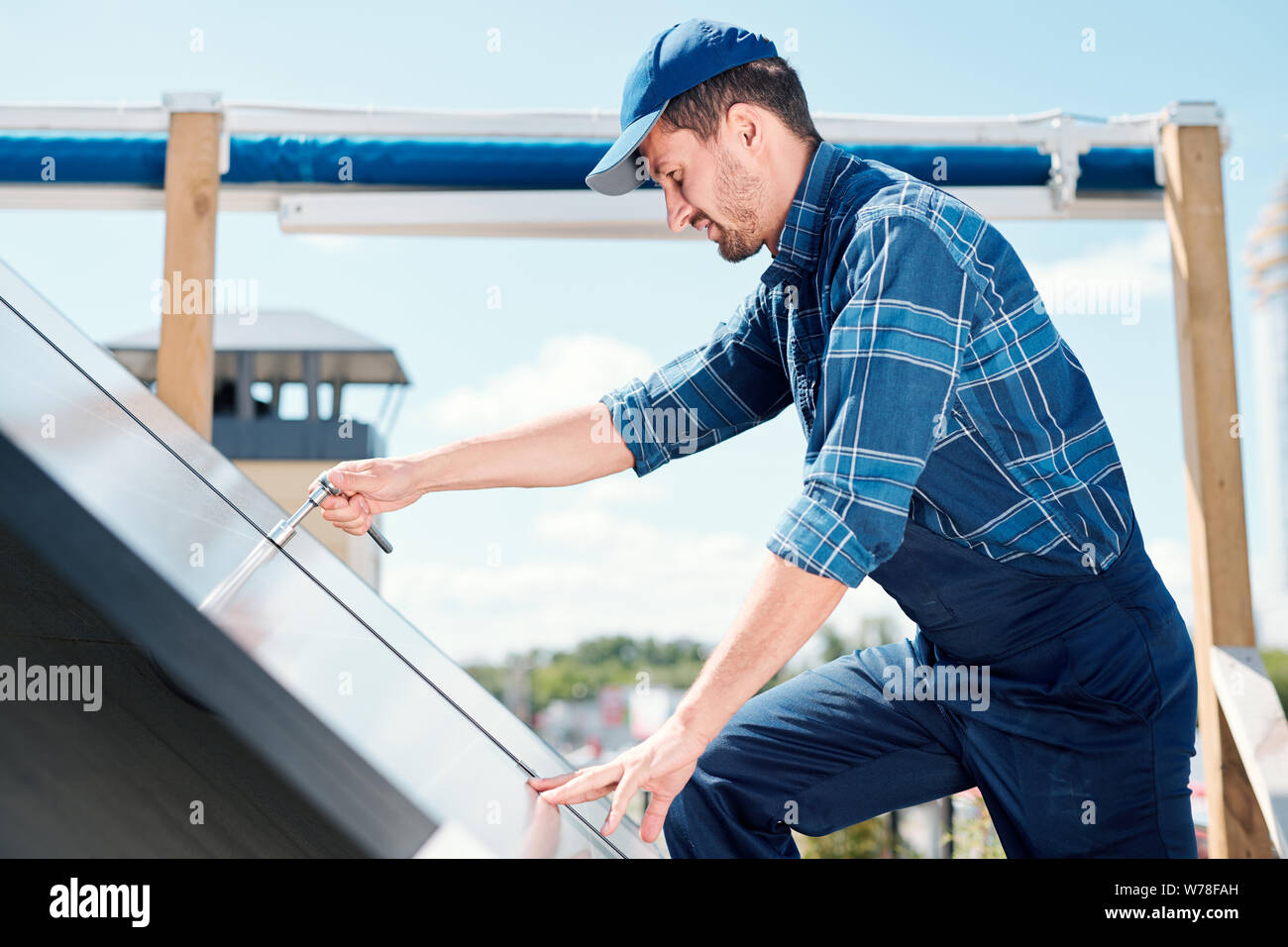Young contemporary technician of customer service repairing handle Stock Photo