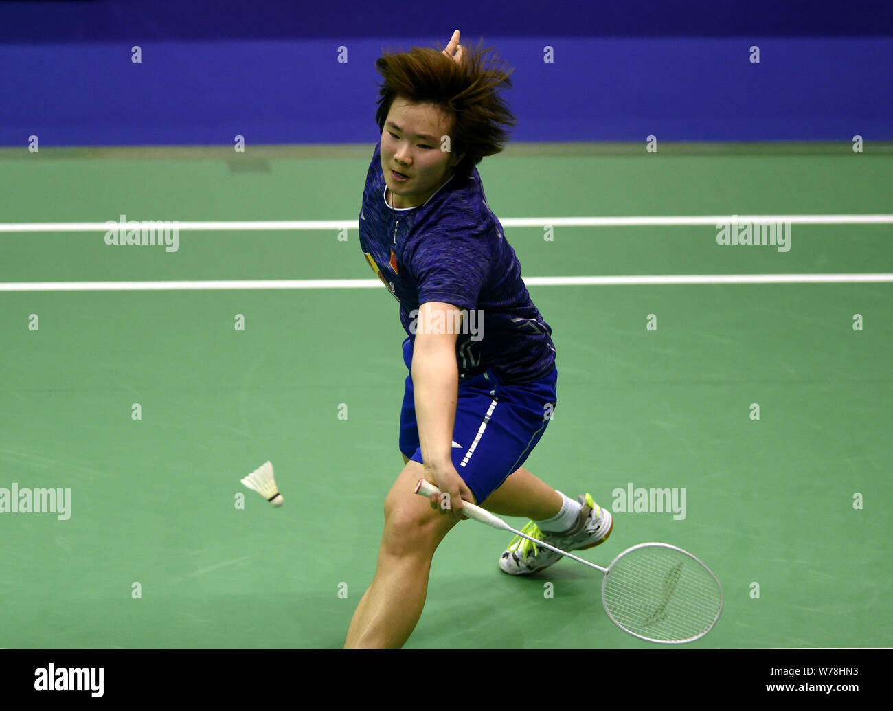 He Bingjiao of China returns a shot to Zhang Beiwen of the United