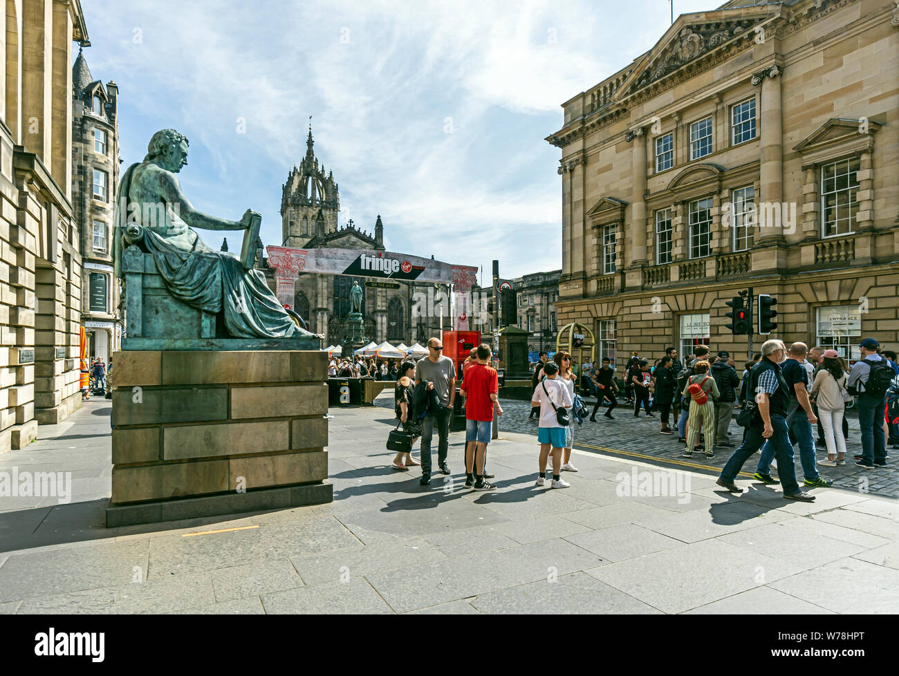 David Hume contemplating the activities at his feet during the Edinburgh Festival Fringe 2019 in the Royal Mile Edinburgh Scotland UK Stock Photo
