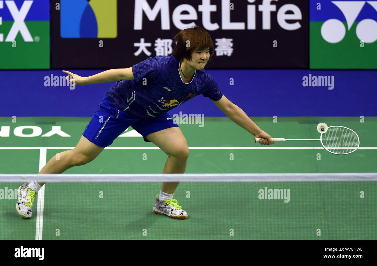 He Bingjiao of China returns a shot to Sung Jihyun of South Korea in