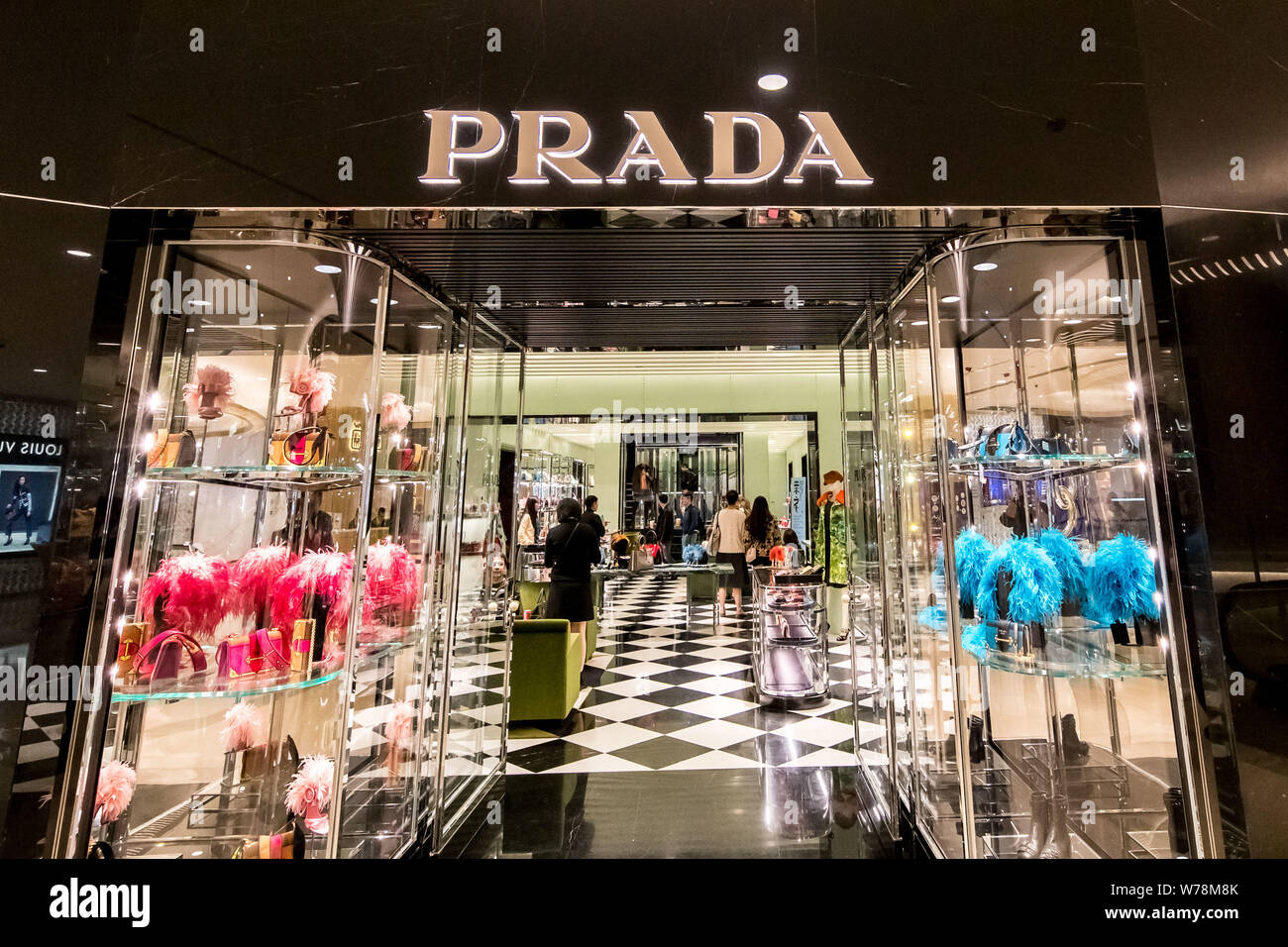FILE--Chinese customers shop in a boutique of luxury brand Prada in  Shanghai, China, 30 October 2017. The 2017 Worldwide Luxury Market Monitor,  jo Stock Photo - Alamy