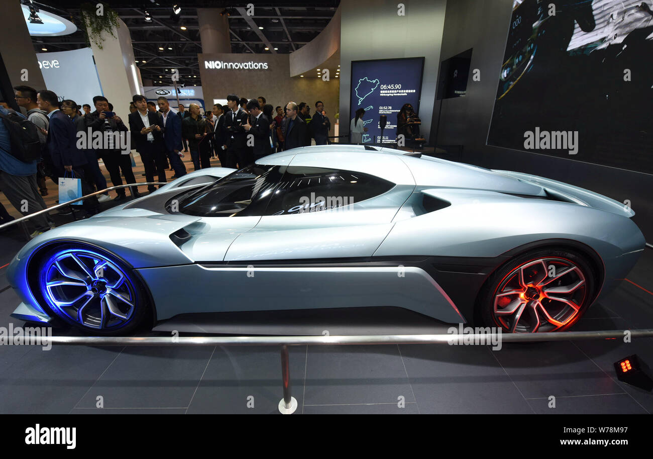 Chinese visitors look at a NextEV Nio EP9 electric supercar on display in Hangzhou city, east China's Zhejiang province, 10 November 2017.    Chinese Stock Photo
