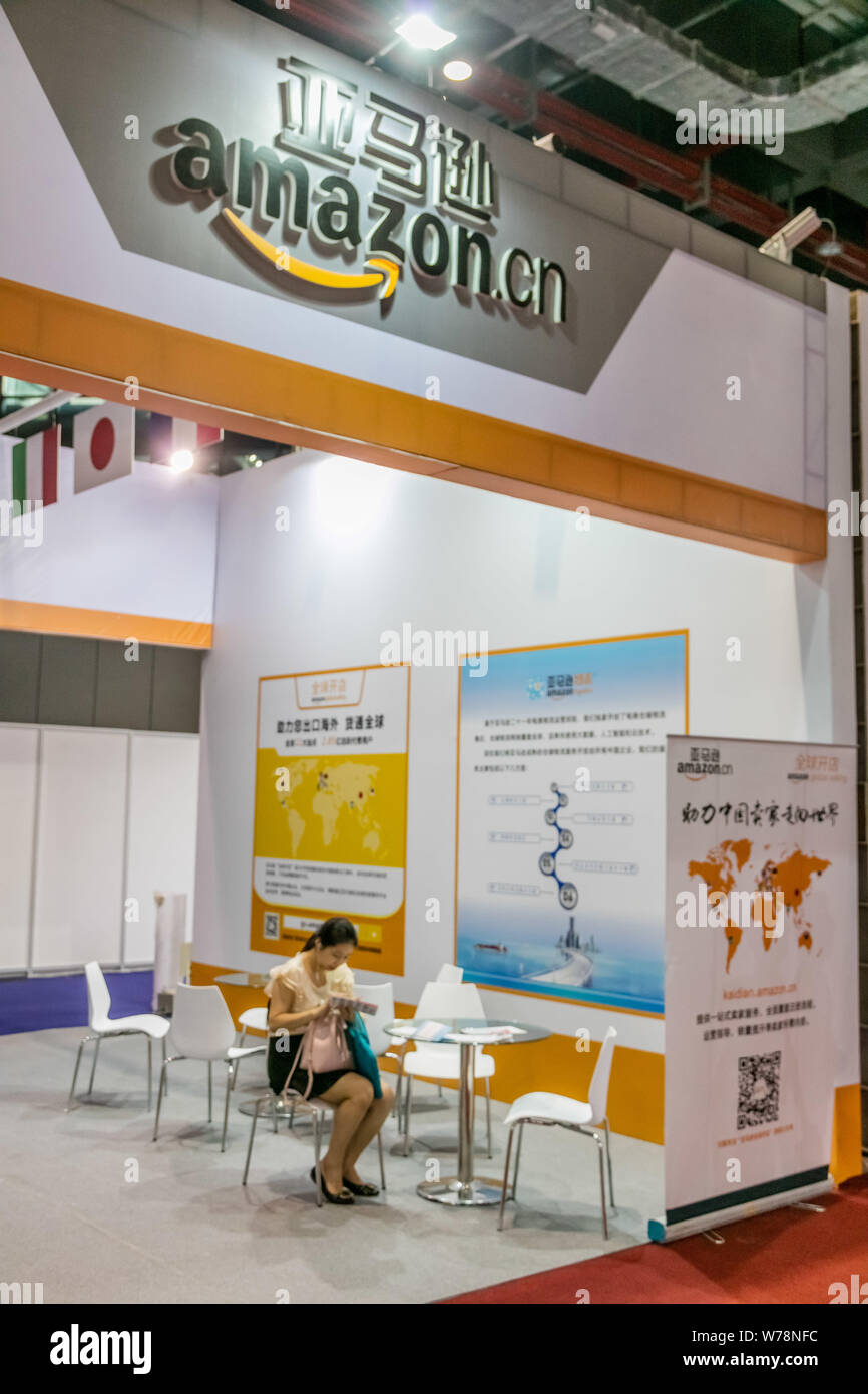 --FILE--A Chinese visitor is seen at the stand of Amazon Logistics of American e-commerce giant Amazon during an e-commerce expo in Shanghai, China, 2 Stock Photo