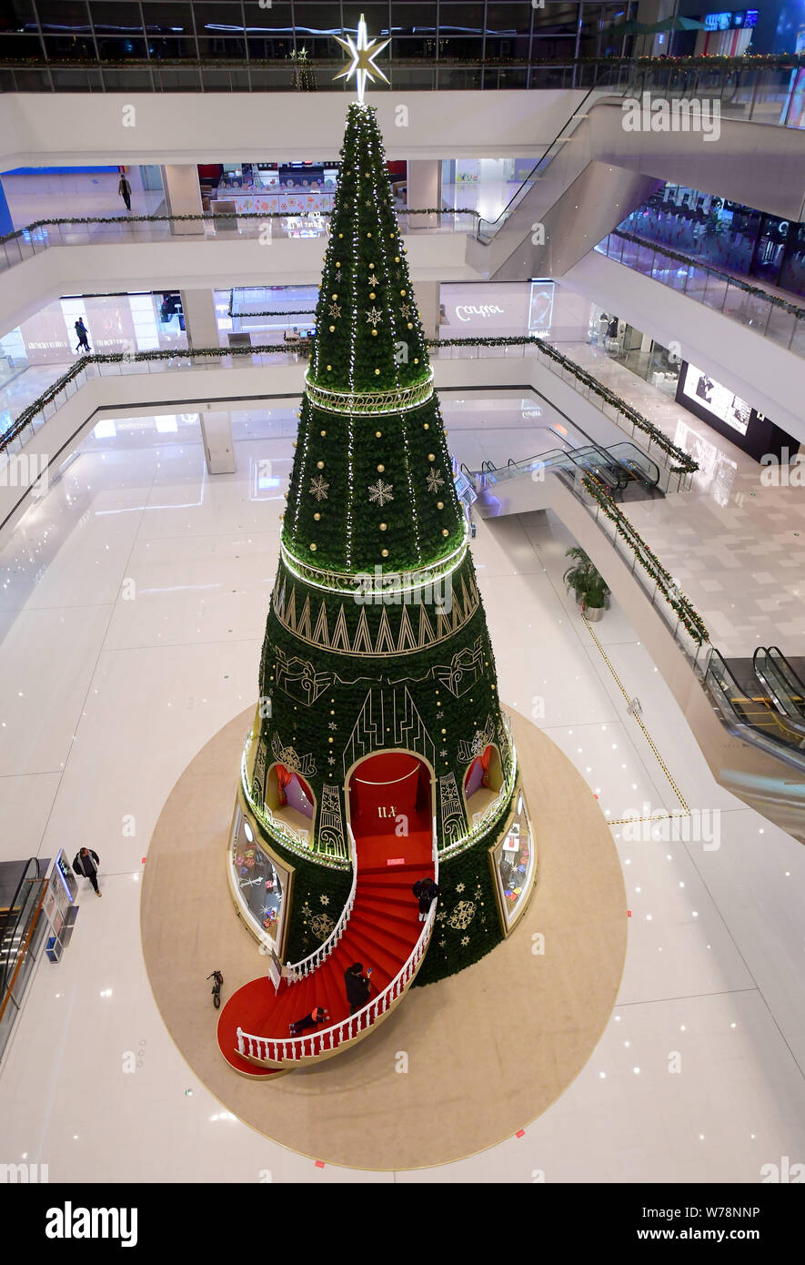 A 40meterhigh Christmas tree art installation is displayed at a