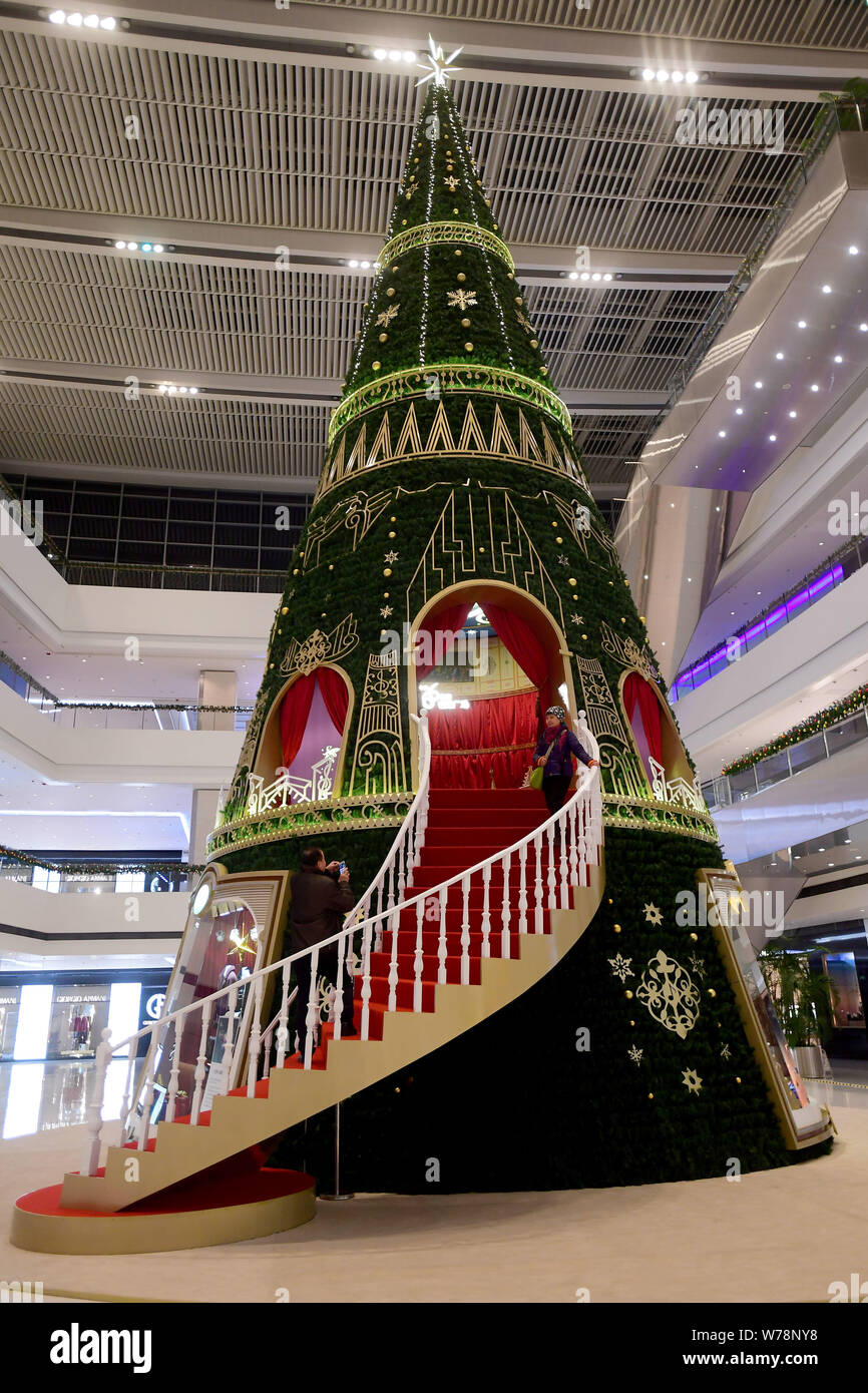 A 40meterhigh Christmas tree art installation is displayed at a