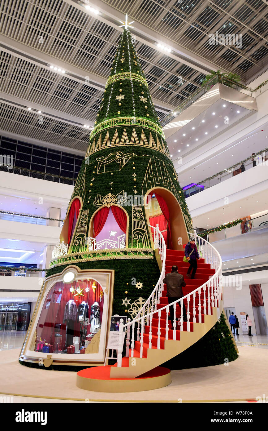 A 40meterhigh Christmas tree art installation is displayed at a