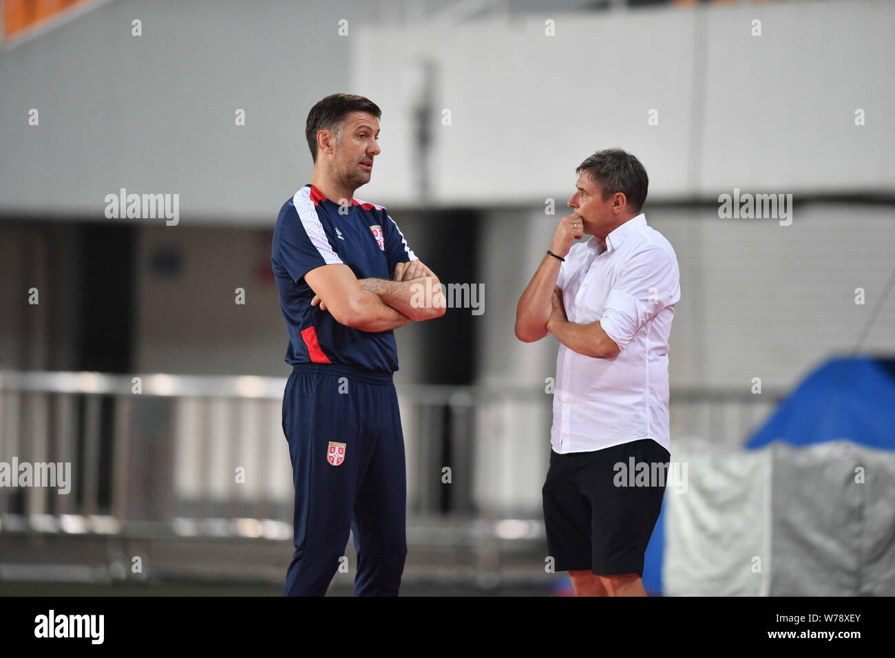 Head coach Dragan Stojkovic of Guangzhou R&F, right, talks with head coach Mladen Krstajic of Serbian national men's football team during Serbia's tra Stock Photo