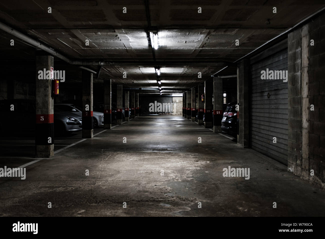 Underground parking lot on a dangerous creepy dark scene Stock Photo