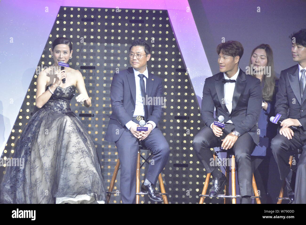 Hong Kong actress Jessica Hester Hsuan, left, also known as Suen Huen, and South Korean singer Kim Joong-kook, third left, attend a promotional event Stock Photo