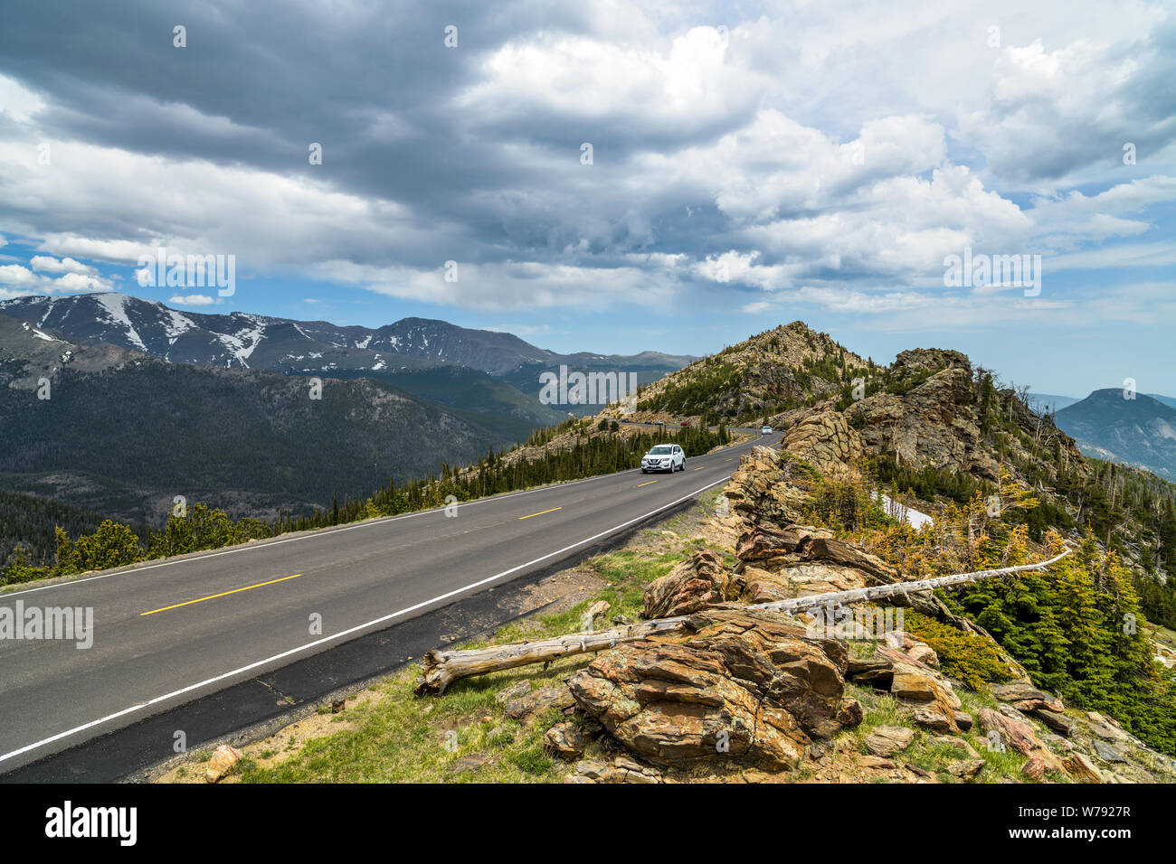 Trail Ridge Road - A stormy Spring day view of a narrow section of Trail Ridge Road winding at top of mountains. Rocky Mountain National Park, CO, USA. Stock Photo