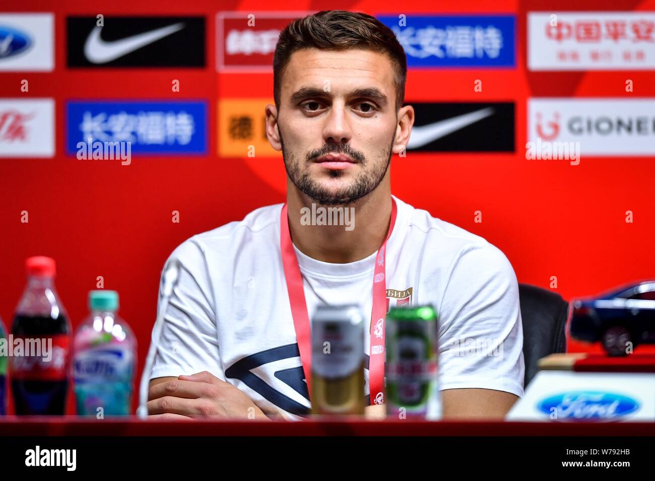 Serbian football player Dusan Tadic of Serbia attends a press conference for the 2017 CFA Team China International Football Match against China in Gua Stock Photo