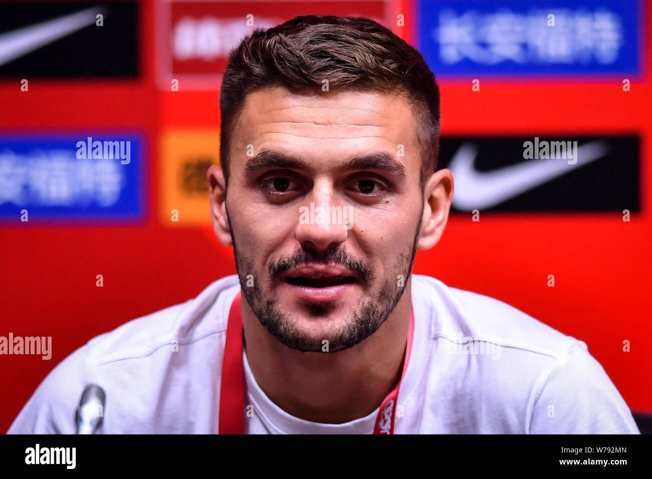 Serbian football player Dusan Tadic of Serbia attends a press conference for the 2017 CFA Team China International Football Match against China in Gua Stock Photo