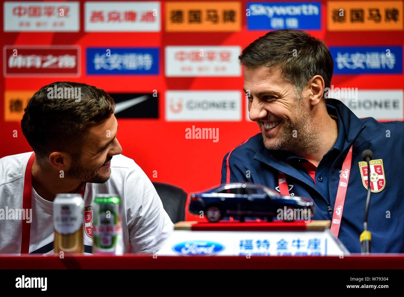 Serbian football player Dusan Tadic, left, and head coach Mladen Krstajic of Serbia attend a press conference for the 2017 CFA Team China Internationa Stock Photo