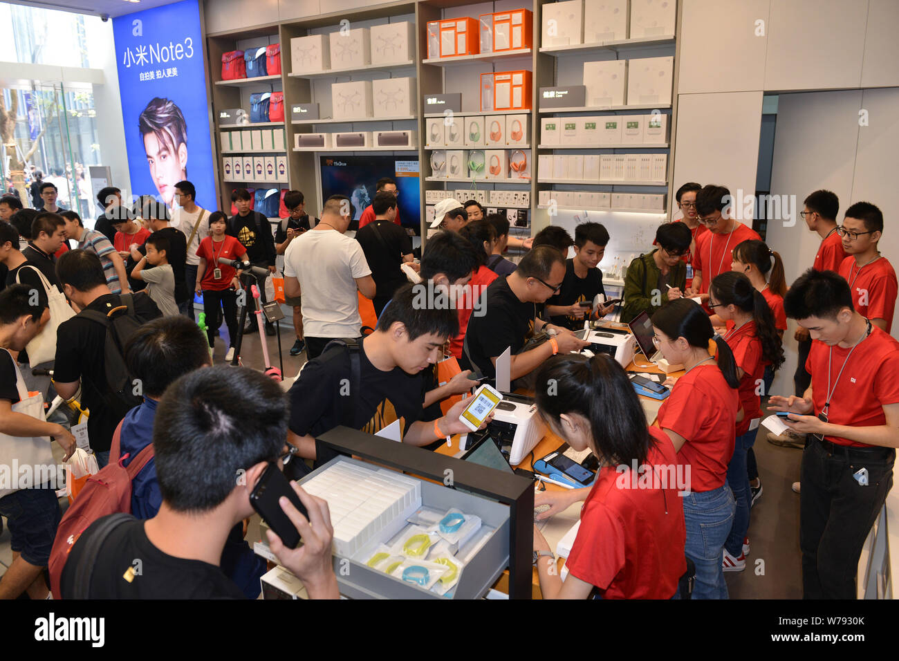 Customers try out smartphones and electronic devices at the world's ...