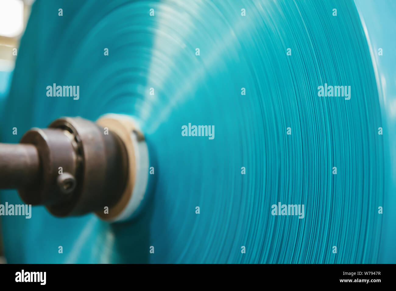 Blue colored polyethylene plastic garbage bag container roll in the