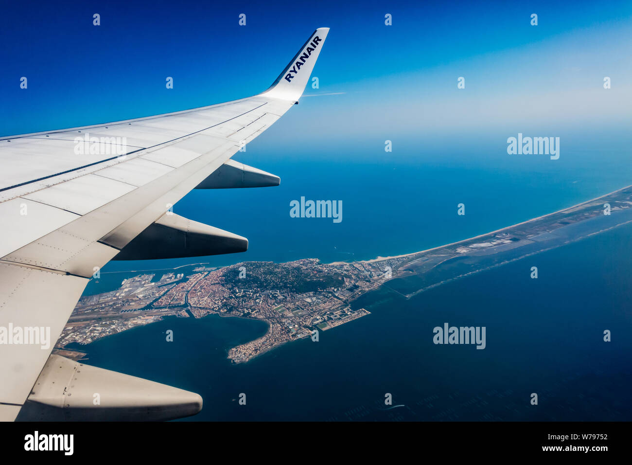 view of a Ryanair Boeing 737 - 800 wing out of plane window in flight over  the Sete in the South of France Stock Photo - Alamy