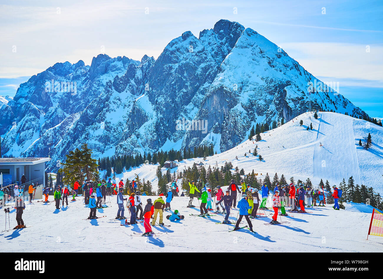GOSAU, AUSTRIA - FEBRUARY 26, 2019: The crowd of skiers prepares for ...