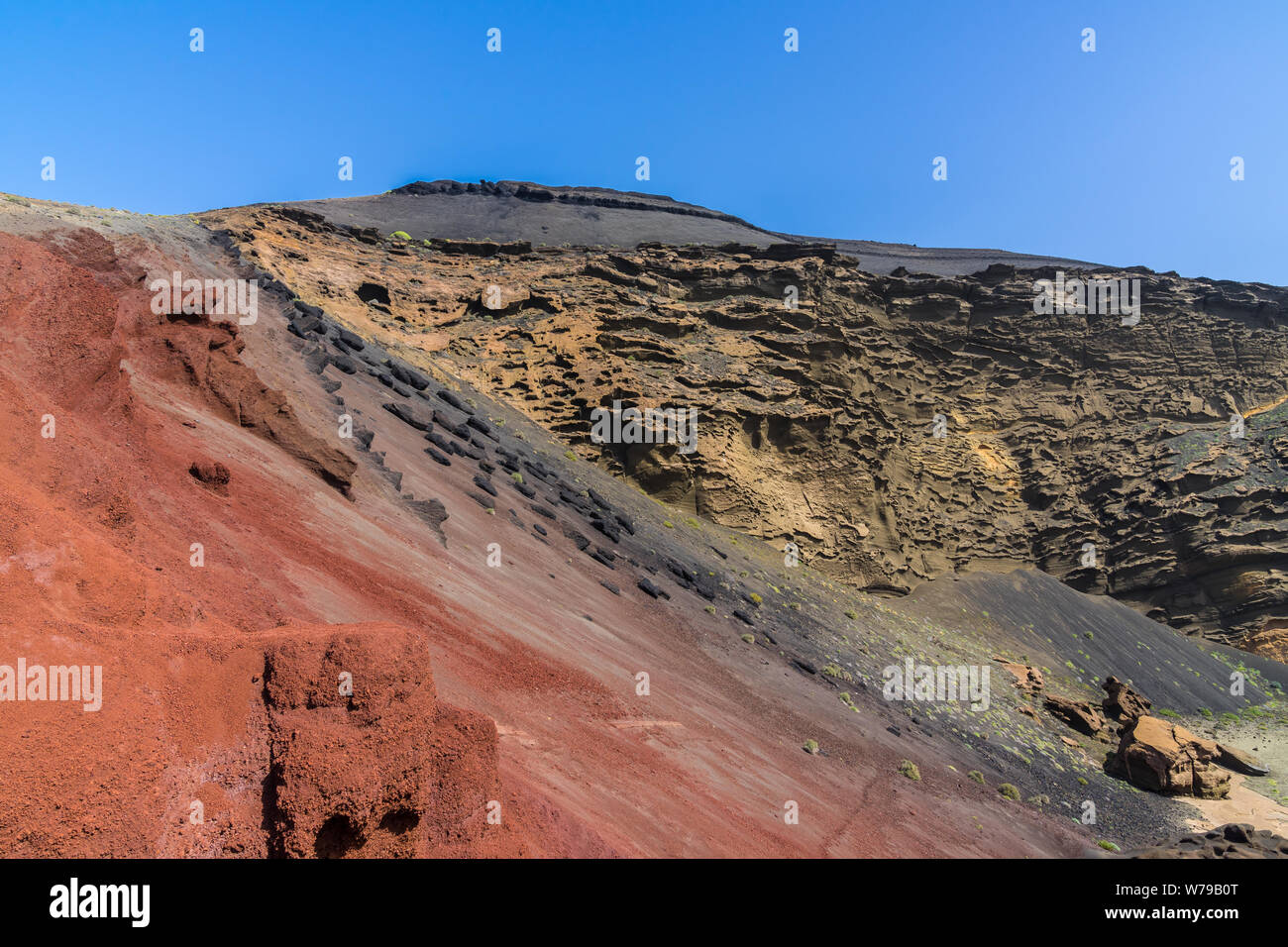 Spain, Lanzarote, Red and black volcanic rock at el golfo bay Stock Photo