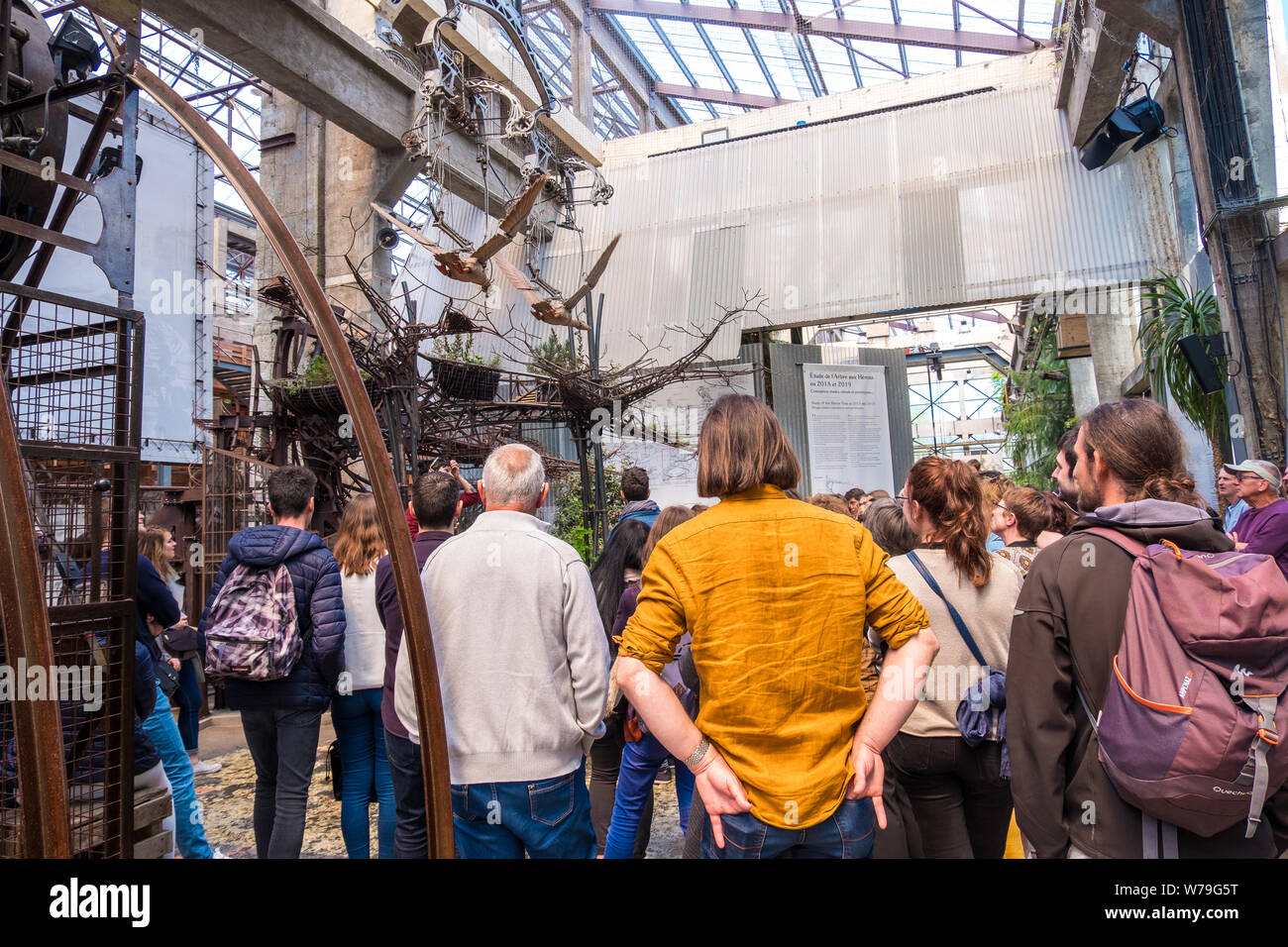 Nantes, France - May 12, 2019: Tourists get acquainted with the exhibits the Hangar des Machines is part of the Machines of the Isle of Nantes, France Stock Photo