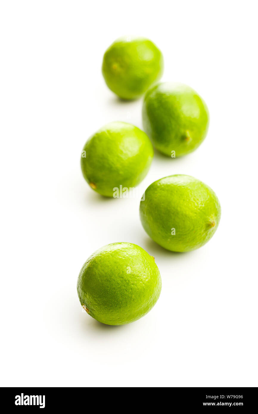 The green limes isolated on white background. Stock Photo