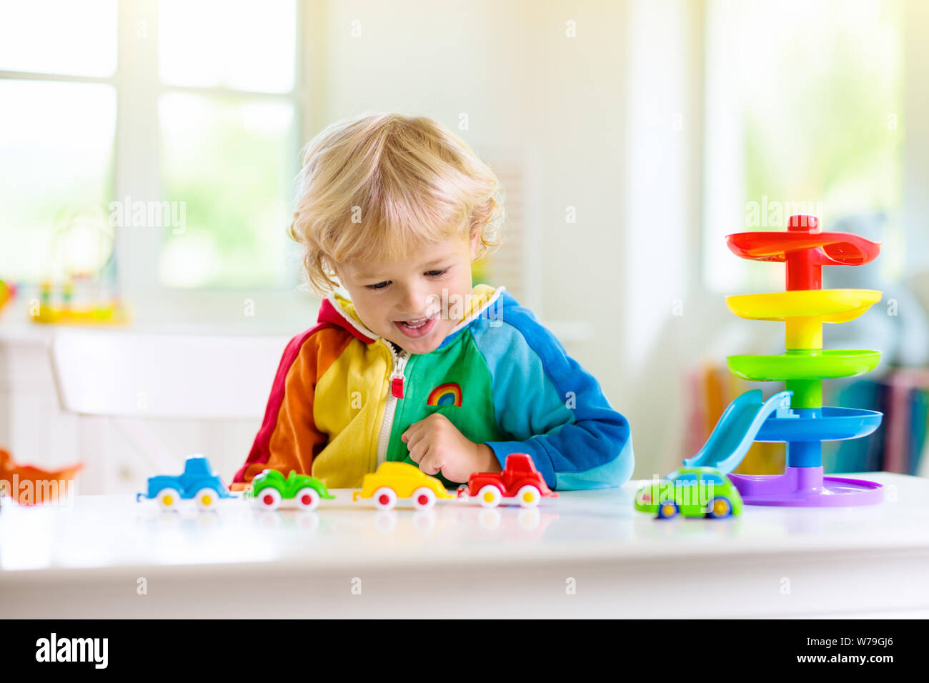 Little Boy Playing Toy Cars Young Kid With Colorful Educational