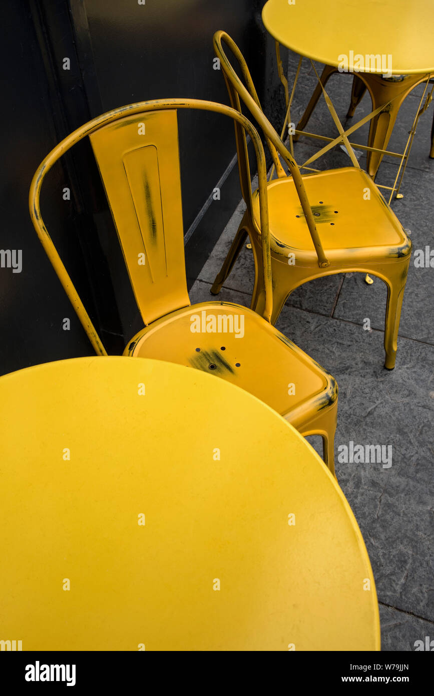 Yellow table and chairs outside a cafe in Edinburgh, Scotland, UK. Stock Photo