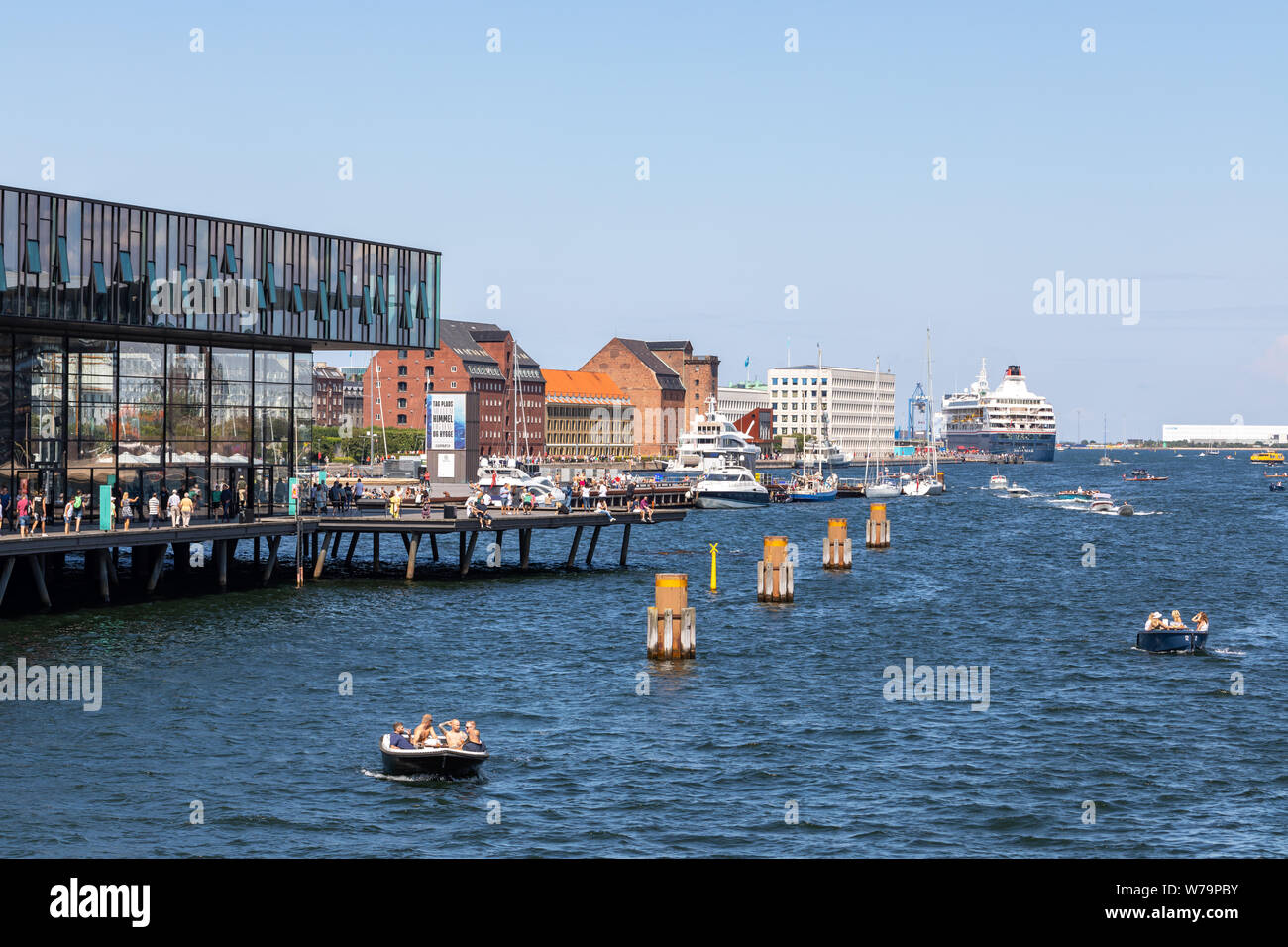 Boats in the harbour of Copenhagen, by the Royal Danish Playhouse, on a summer afternoon Stock Photo