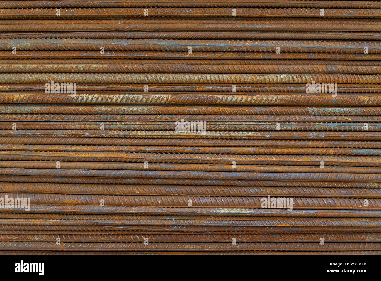Top horizontal close up view stack of straight old rusty high yield