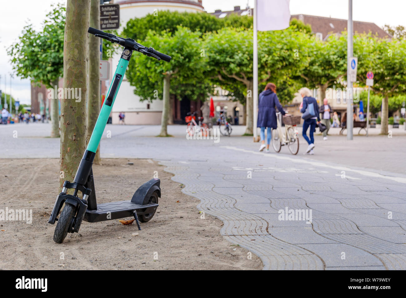 E-scooter, Eco friendly mobility concept, park on promenade riverside of  Rhine River in Düsseldorf, Germany Stock Photo - Alamy