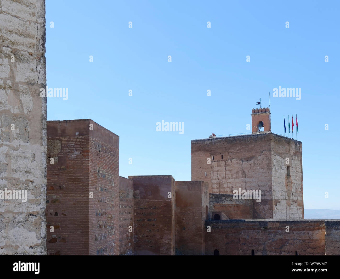 The massive walls of the Alhambra fortress, remember to visitors that, the southern area of Spain, some centuries ago, was ruler under Islamic rulers. Stock Photo