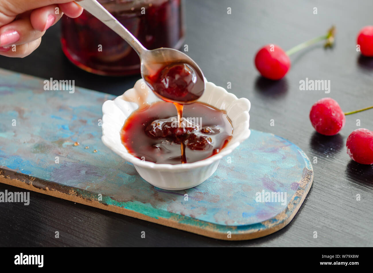 Delicious Sour Berry Jam in bowl  on the woodentable. Stock Photo