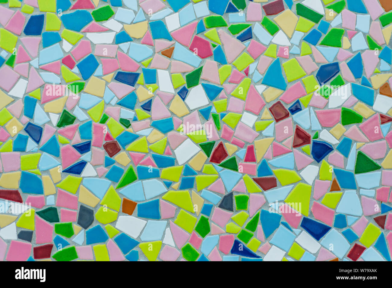 Colorful pastel vivid colour and various geometric shape and size of mosaic tile with random pattern. Stock Photo