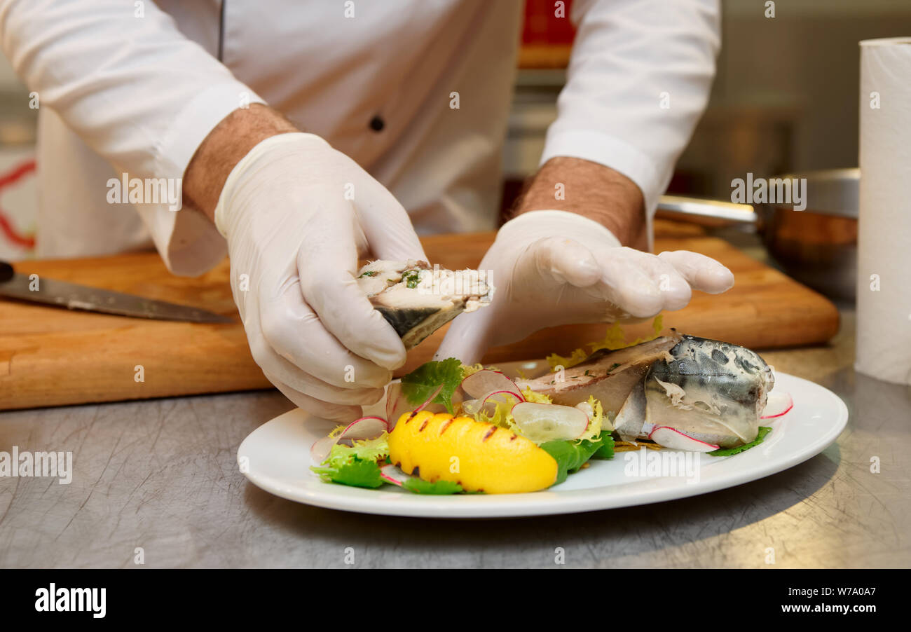 Chef is serving steamed mackerel fish, healthy food Stock Photo Alamy