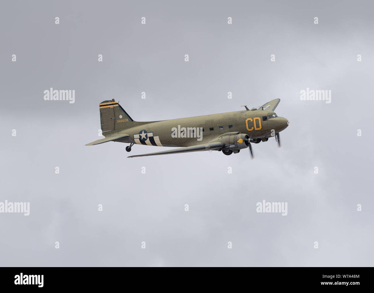 Image of Douglas C-47 Skytrain 'Betsy's Biscuit Bomber' shown flying low over the Chino Airport in Southern California. Stock Photo
