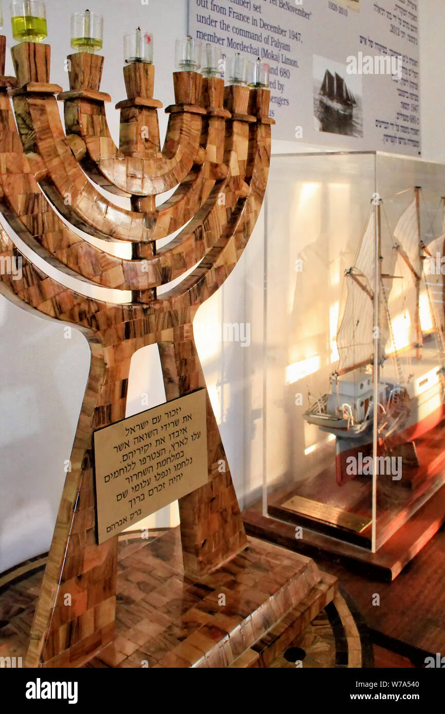 A wood Hanukkah Menorah stands in the Atlit Detainee Camp Museum near Haifa in Israel. Stock Photo