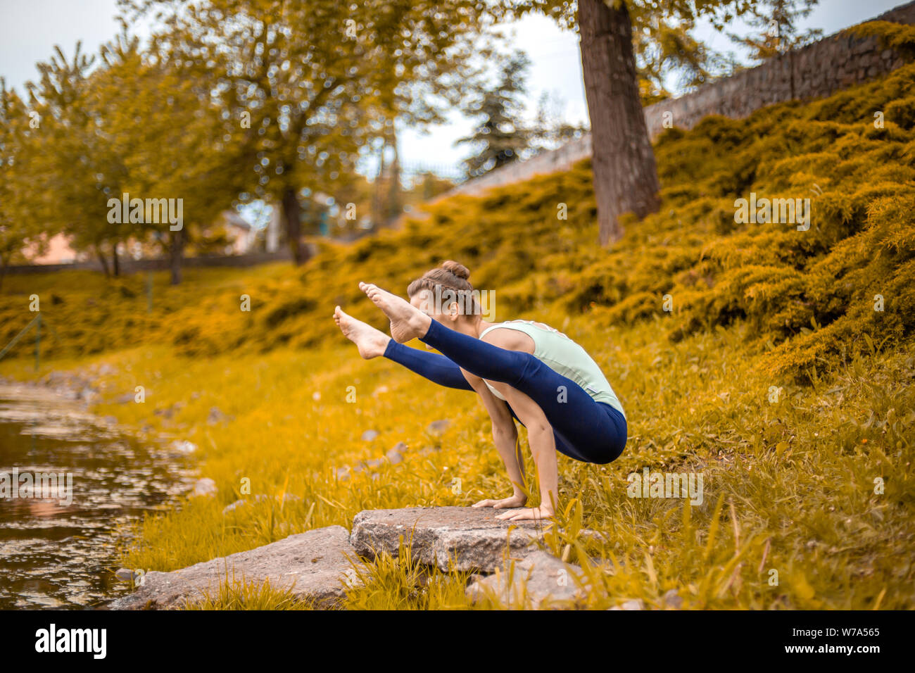 Slim brunette girl goes in for sports and performs yoga poses in Slim brunette girl goes in for sports and performs yoga poses in