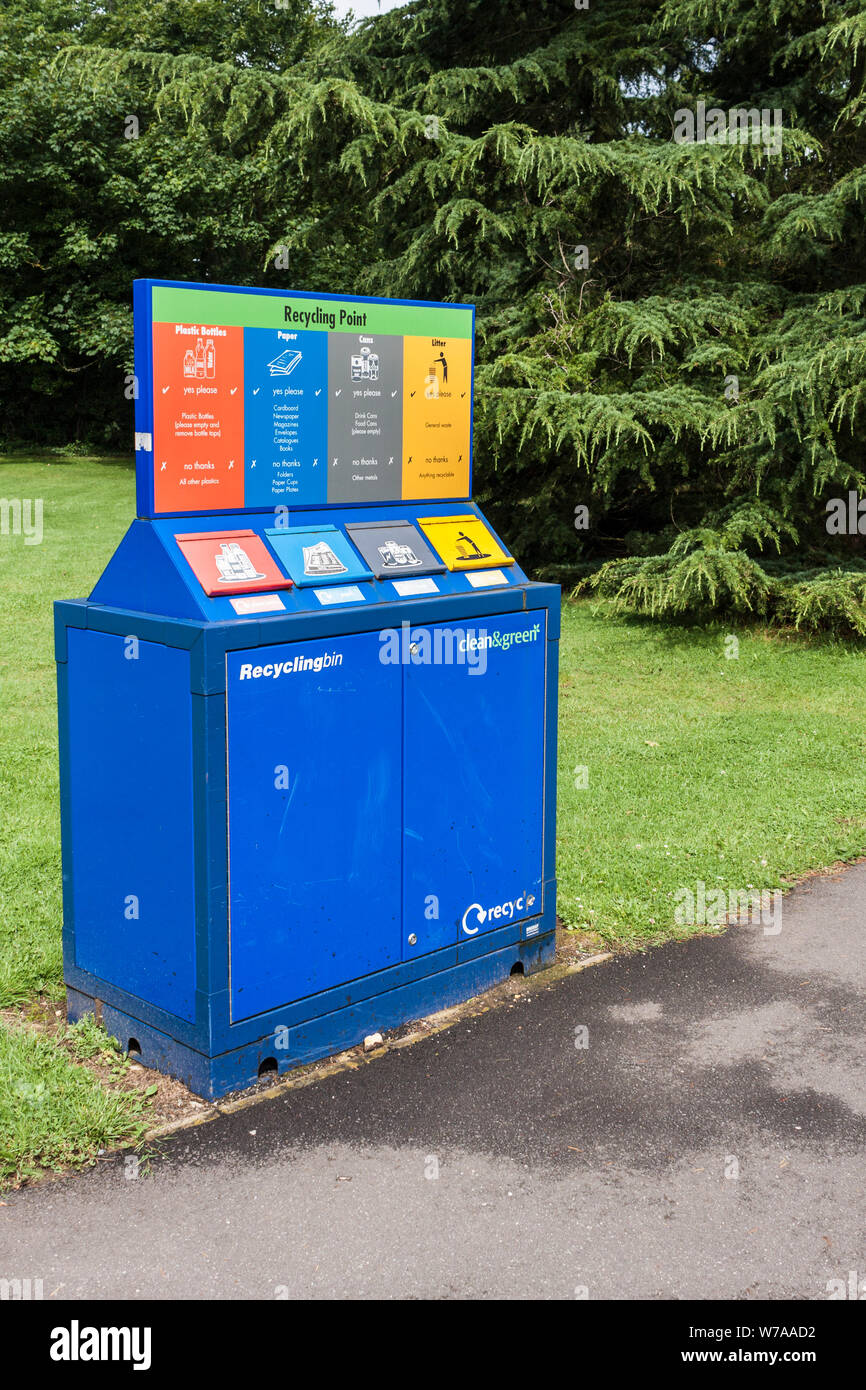 Recycling Point colour coded for plastics, paper, cans and general waste litter Stock Photo