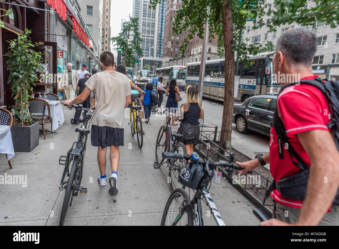 tourists with rented bicycles  Manhattan, New York City, USA Stock Photo