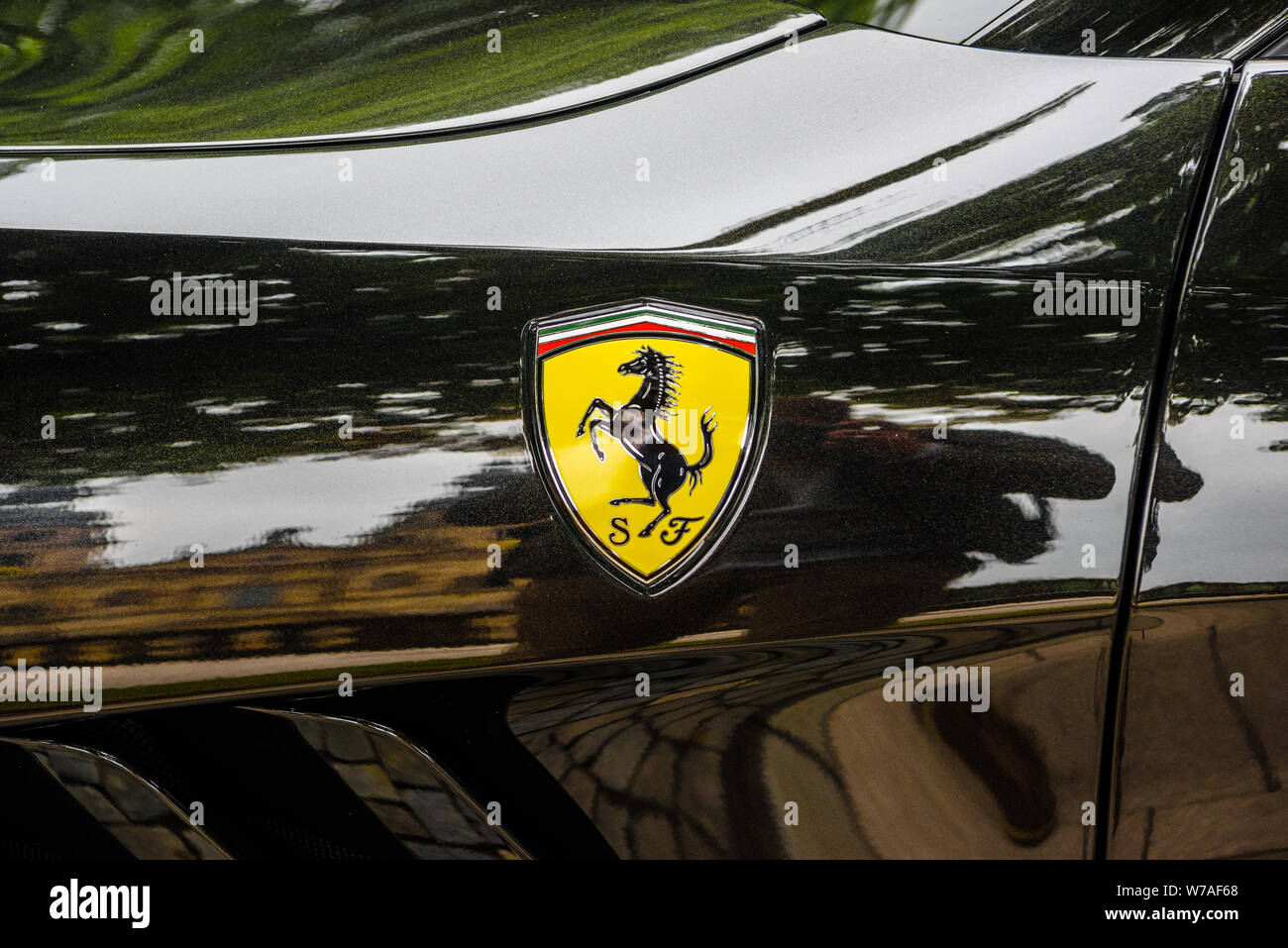 GERMANY, FULDA - JUL 2019: A close-up of the Ferrari logo on a black car. Stock Photo
