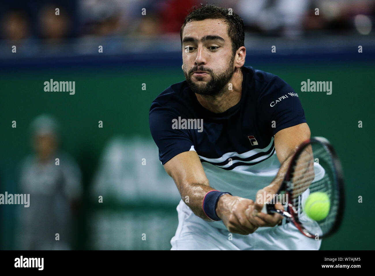 Marin Cilic of Croatia returns a shot to Rafael Nadal of Spain in their semifinal of men's singles during the Shanghai Rolex Masters tennis tournament Stock Photo